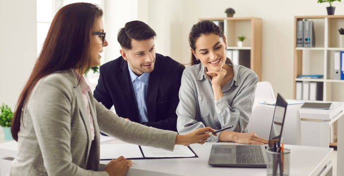 couple speaking to an estate agent